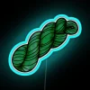 A skein of yarn in a neon fern green hue, with a subtle blue undertone.