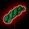 Neon green yarn skein on a vibrant red background with neon accents.