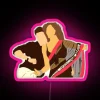 Ranbir Kapoor and Deepika Padukone in Yeh Jawaani Hai Deewani under a colorful neon sign.