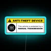Yellow Anti-Theft Device Warning Sign with 5-Speed Manual Transmission Icon