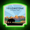 A neon sign illuminates Yellowstone National Park at dusk.