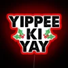 Neon "Yippee Ki Yay" sign in bright red color scheme.