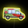 Red neon sign reading 'Yorkshire Tea Van' on a bright yellow background.