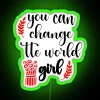 Neon sign with inspirational quote about empowering young women to make a positive impact on the world.