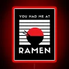 Neon sign with colorful ramen letters in a Japanese restaurant setting.