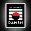 A vibrant neon sign featuring colorful letters that read "You Had Me at Ramen" in bold, playful font.