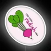Neon sign with colorful, glowing letters reading 'You look radish-ing'