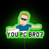 RGB Neon Sign on a Computer Desk, close-up of a green neon sign reading You PC Bro".