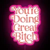 Neon sign with inspirational phrase in pink and red RGB colors.
