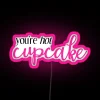 Neon pink sign with bold, cursive letters reading "You're Hot" in a futuristic, high-contrast color scheme.