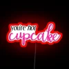 Neon sign with bold, red letters that read 'You're Hot'