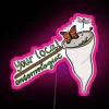 Neon sign reading 'Your Local Entomologist' in pastel pink colors against a dark background.