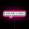Neon sign reading 'Your waifu is trash' in RGB colors.