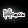 A cute cat with neon lights surrounding its face, looking rather startled or confused, in a bright white background.