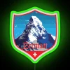 Neon sign reflecting off buildings in Zermatt, Switzerland's vibrant nightlife scene.