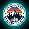 Neon-lit sign on the Zugspitze mountain in Germany.