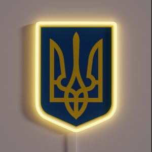 Idi Nahui A Stylised Trident Symbol In Gold On A Background Shield RGB Neon Sign